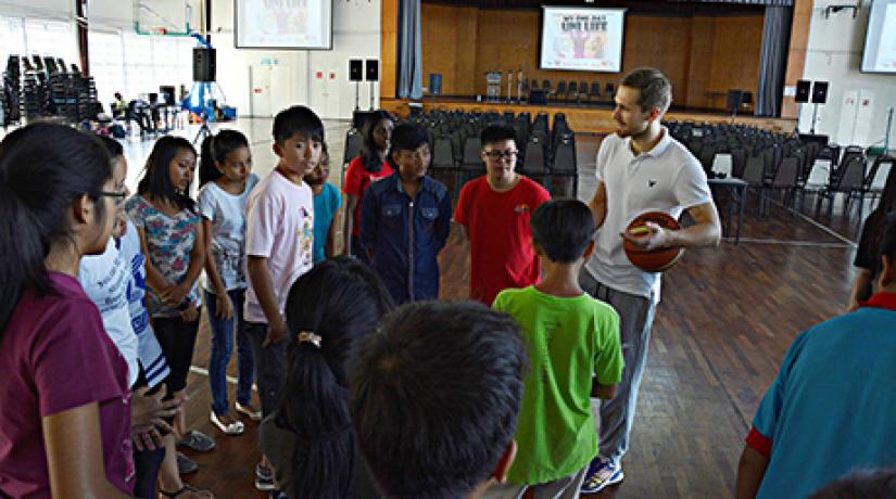 FUN TIME: Student Affairs & Alumni division head (Sports and Fitness Department) Vitalii Goncharenko engaging children in a basketball game. FUN TIME: Student Affairs & Alumni division head (Sports and Fitness Department) Vitalii Goncharenko engaging children in a basketball game.