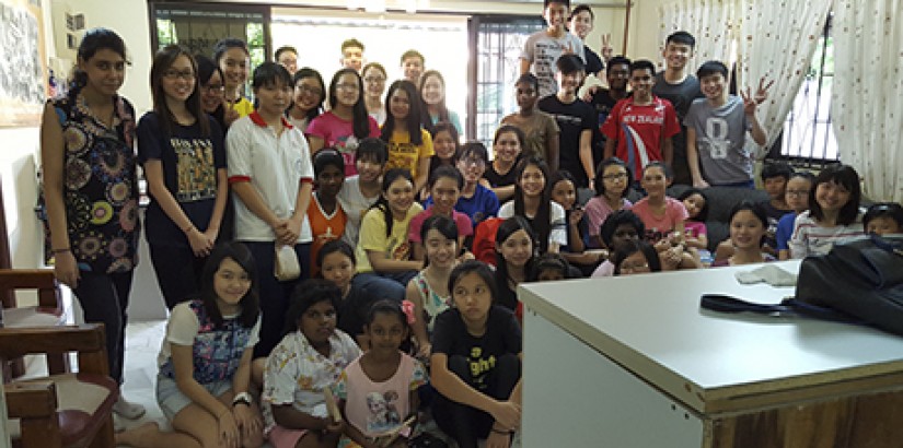 [ALL SMILES]: UCSI’s Hope Revive Club posing in a group photo with the girls of Rumah Kasih Orphanage.
