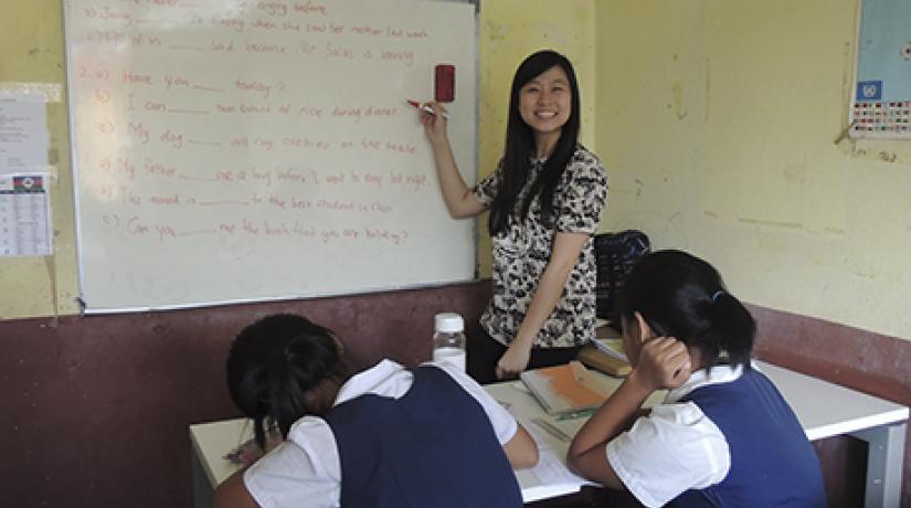  PASSION FOR CHILDREN: UCSI Psychology student Suzanne Ling teaching English to Burmese refugee children.