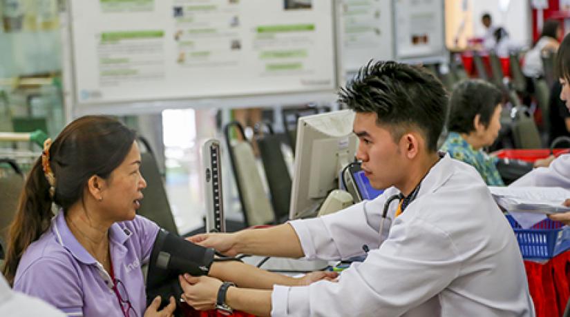 FREE HEALTH CHECKS: UCSI pharmacy students conducting free health checks including blood pressure tests during the UCSI Annual Public Health Campaign.