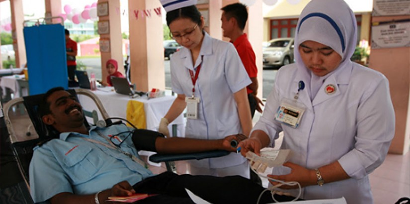 A medical student at the UCSI University Terengganu campus checking the blood pressure of one of the participants during the Public Heath Campaign that was held in conjunction with the University's 25th Anniversary Celebrations