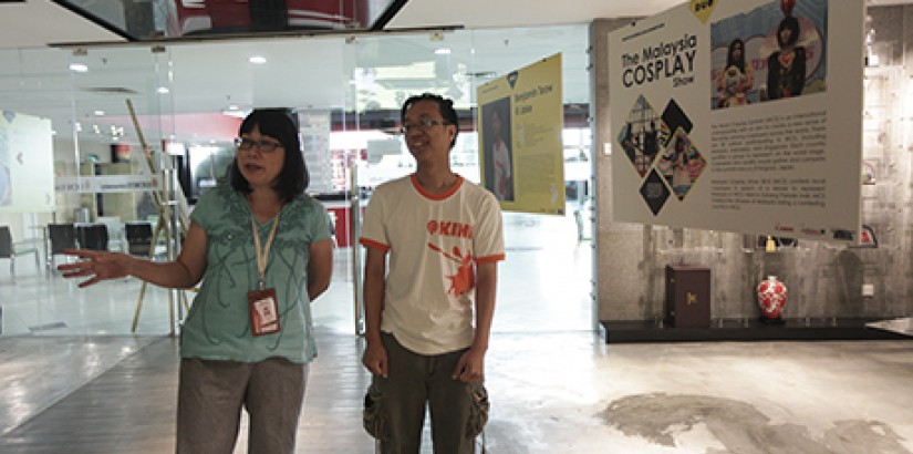  WORDS OF WISDOM: Asst Prof Dr Chan commenting on Benjamin Teow’s photos taken at cosplay conventions.
