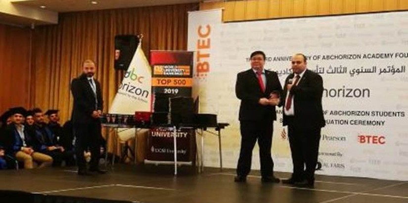 Chan Joe Jim, Senior Manager, UCSI’s Student Enrolment Centre being introduced on stage by Dr Bassem Saffo, General Manager of ABC Horizon Academy during the graduation ceremony.