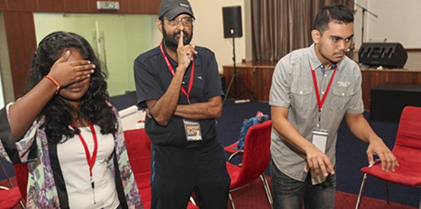  STRIKE-A-POSE: At 68 years old, Melville Jayathissa (middle) was the oldest and most sporting contestant. Here, he and his teammates pose with their version of the ‘Three Wise Monkeys’ pictorial maxim at UCSI’s Poetry Slam Workshop 2015.