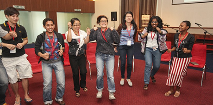  ICE-BREAKING: Trainer, Elaine Foster (middle) warming up the participants by making them choose an action that describes them the most.