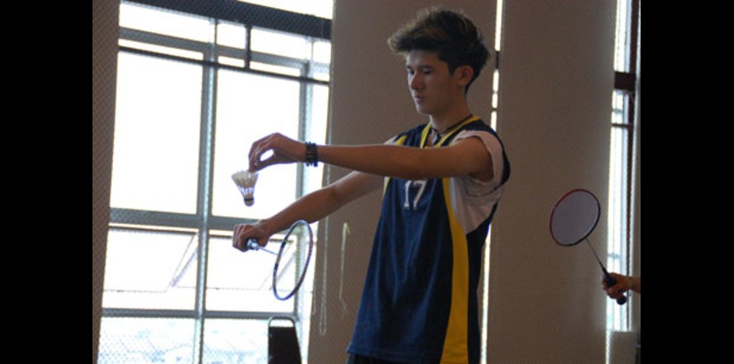  TOTAL FOCUS: One of UCSI’s Pre-U players prepares to strike the shuttlecock over the net to his opponent, giving his undivided attention to the doubles match.