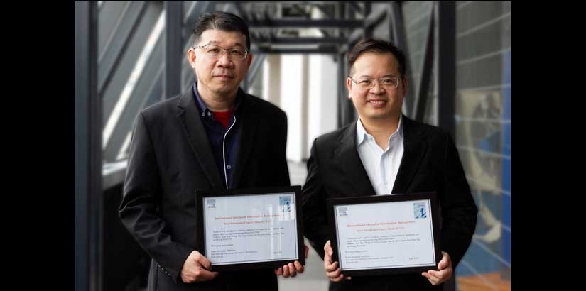 (l to r) Professor Ooi and Dr Garry received certificates from Elsevier Ltd.