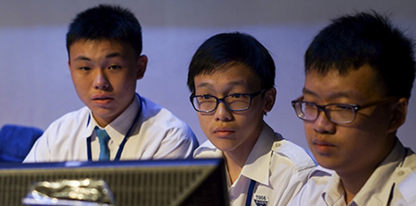 FOCUSED: Participants from Kuen Cheng High School reading the questions on screen.