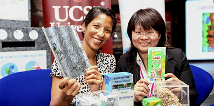  Manjula Murugesan (left) holds a sample of the sturdy roof tile made from drink cartons similar to the one held by Asst Prof Dr Crystale Lim.