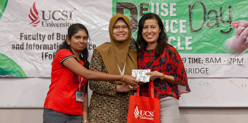 (left to right) Salini Devi Rajendran and Assistant Professor Siti Norida giving a token of appreciation to Sharon Lee from the National Cancer Society Malaysia.