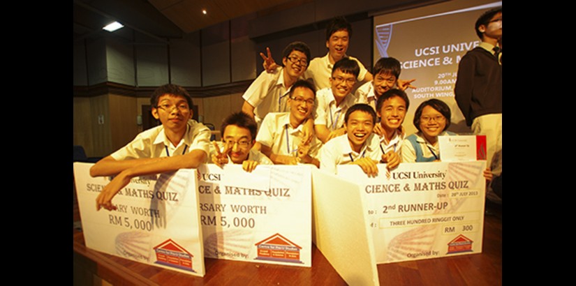  ALL SMILES: Winners and bursary award recipients posing with their mock cheques during the recent UCSI University Science and Mathematics Quiz 2013.