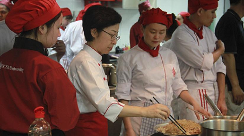  NOODLE TIME! Seoul University (Food Science and Nutrition department) Adjunct Professor Kim Kyung Mi performing a quick demo on cooking japchae.