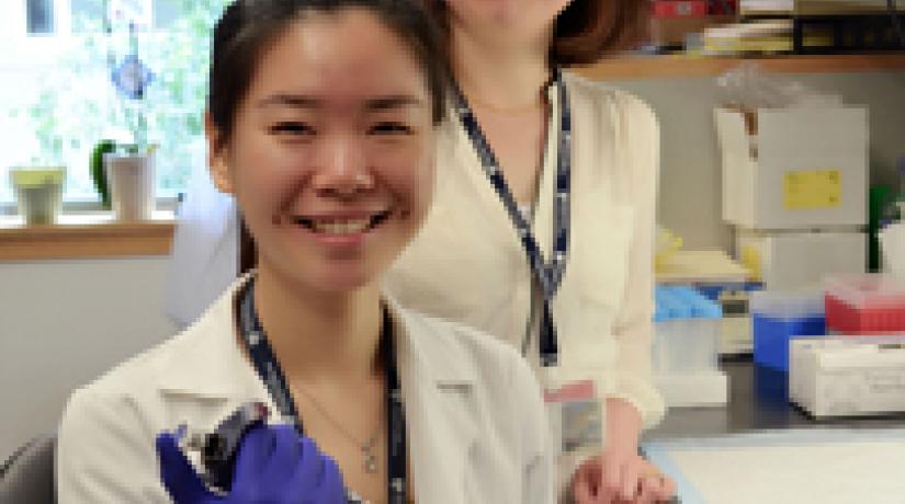 Tan Jia Wei (left) pictured with postdoctoral researcher Yuefei Huang at one of Harvard's labs.