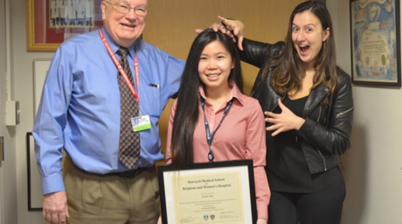 Ting Pei Yee (centre) celebrates her completion of the one-year Pre-Doctoral Research Training Programme at Harvard Medical School with her mentor Professor Dr Gordon Williams (left) and his executive assistant Haris Lefteri.