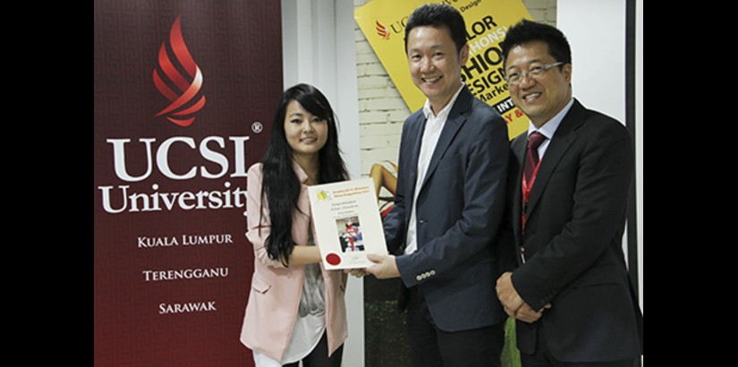  ALL SMILES (From left): One of UCSI University's DIAND students receiving her prize from Malaysian Footwear Manufacturers Association (MFMA) president Mr Tony Ting.
