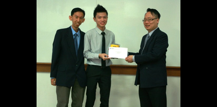  Engr. Rodney Tan Hean Gay and Lee Thean Chai receive their certificates and trophies from James Lai, Area Sales Manager for NI.