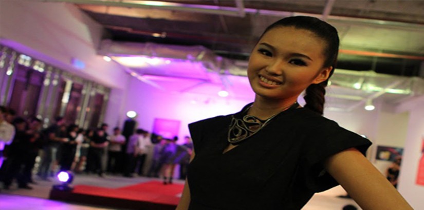 A model parades one of UCSI University's Fashion student's couture creation at the Wei-Ling Contemporary Gallery