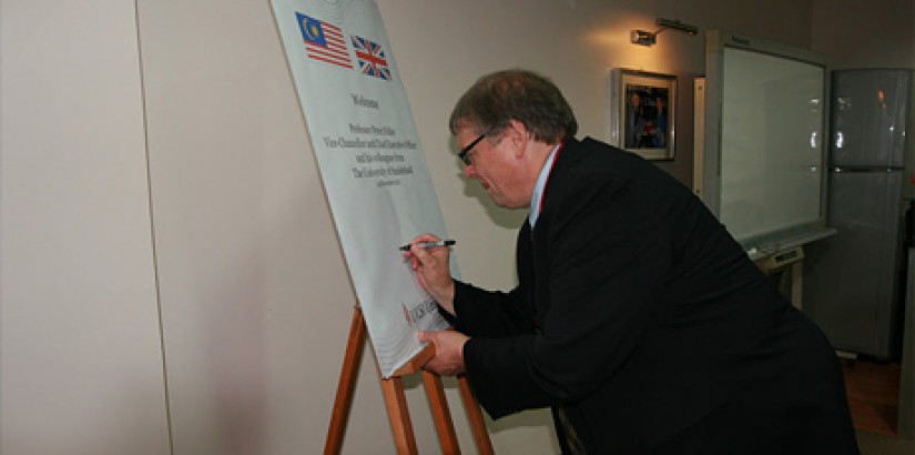  The University of Sunderland​’s Vice- Chancellor and Chief Executive Officer, Professor Peter Fidler signing the welcome board during the visit.