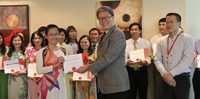 English teacher Ms Nguyen Thi Yuan receiving a certificate from UCSI's deputy vice-chancellor (Academic Affairs and Research) Prof Dr Teoh Kok Soo during the graduation ceremony. English teacher Ms Nguyen Thi Yuan receiving a certificate from UCSI's deputy vice-chancellor (Academic Affairs and Research) Prof Dr Teoh Kok Soo during the graduation ceremony.