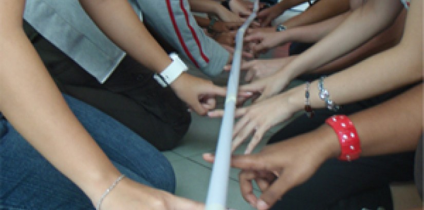 Participants having a ball of a time in the Helium Stick" game