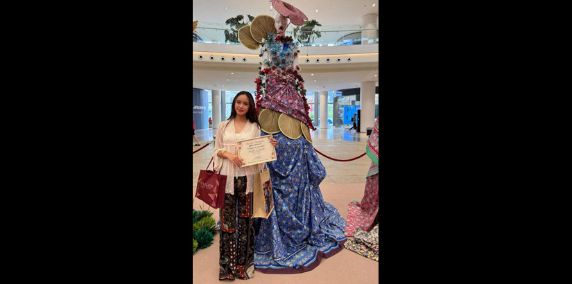 Aina Hadfina Khairulnizam with her Sabah-inspired Batik installation