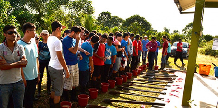  READY FOR ACTION: UCSI University's Engineering students all lined up with the necessary materials to kick-start their tree planting campaign at the Raja Musa Forest Reserve.