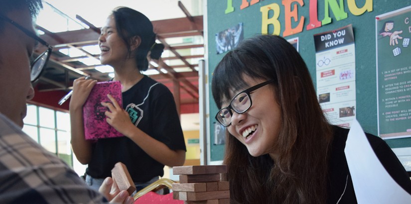 ELSA members and participants at the English Literature booth playing the ‘Literary Jenga’.