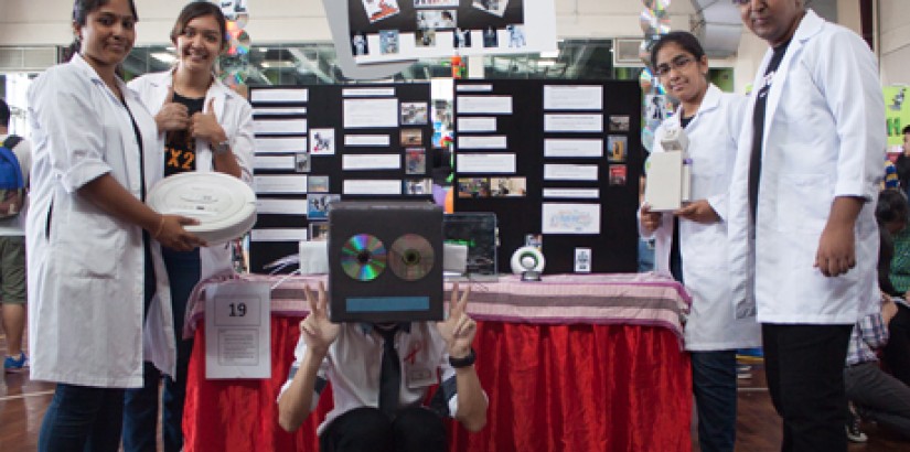 Students passionate about robotics with their booth showcasing the topic.