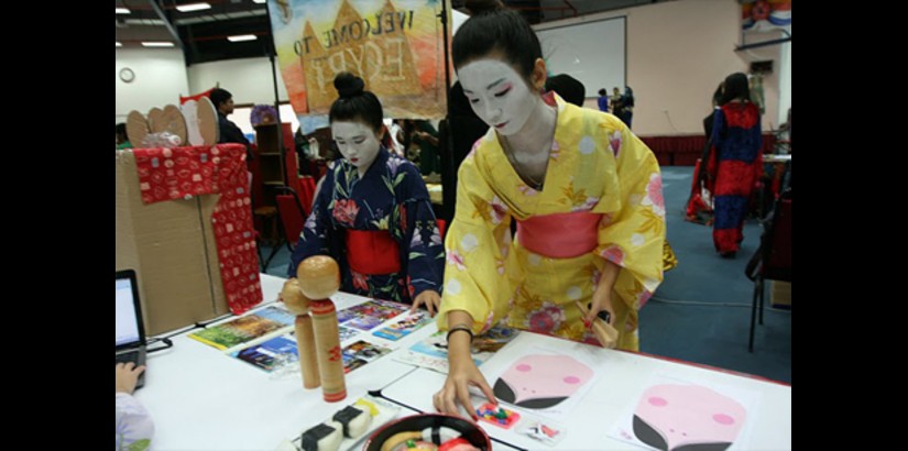 Students showcasing something unique with the theme ‘The Melting Pot of UCSI’, complete with traditional dances and costumes, food and colourful posters, as well as performances