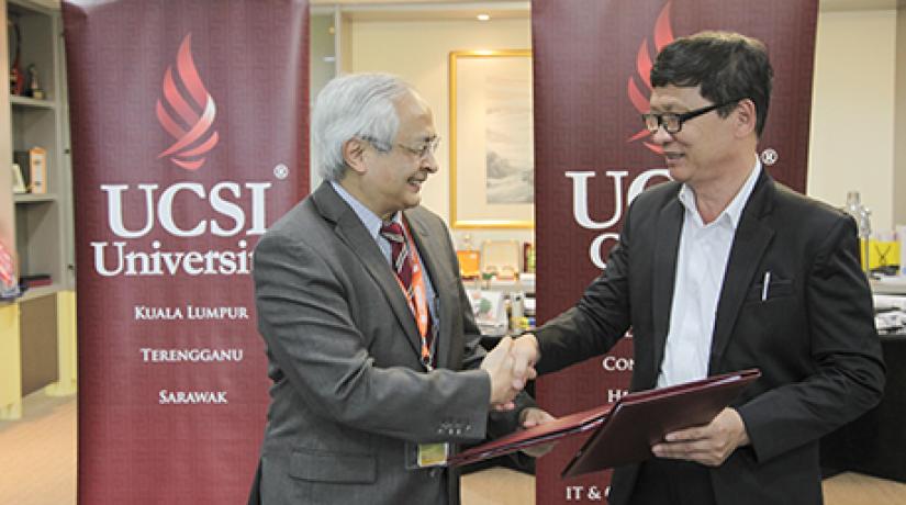  WORKING TOGETHER: Senior Professor Dato’ Dr Khalid Yusoff, Vice-Chancellor and President of UCSI University (left) and Dr Ta Xuan Te, CEO of NTTU exchanging the signed MoUs.