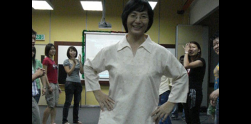 A parent doing the catwalk at a mock fashion show