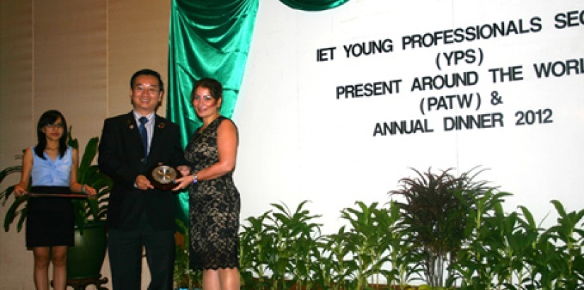 ALL SMILES:(From left)IET Malaysia Network Chairman Mr Lawrence Lai presenting the Young Woman Engineer of the Year Award 2012 plaque to Dr CEngRozita Teymourzadeh at the recent IET- YPS Annual Dinner.