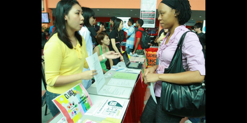 A member of the Peer Counselling Group, (a UCSI University registered society), briefs a student interested in joining the group