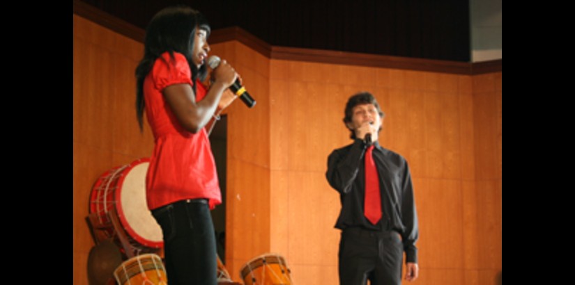 Abigail and Oskar, singing a rousing song for the new students.