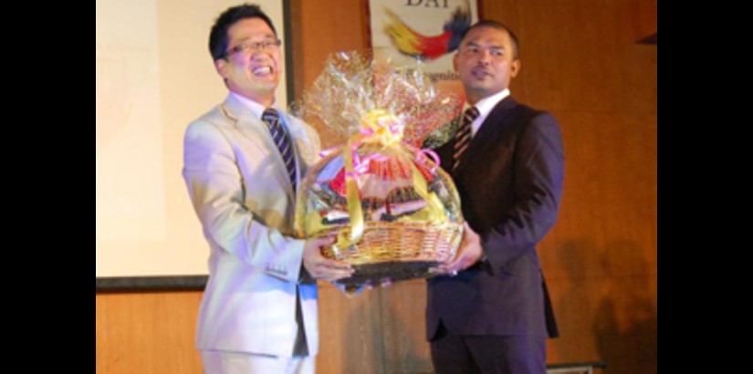 UCSI University Group President and Vice Chancellor, Peter Ng presenting a souvenir to the Deputy Minister of Higher Education