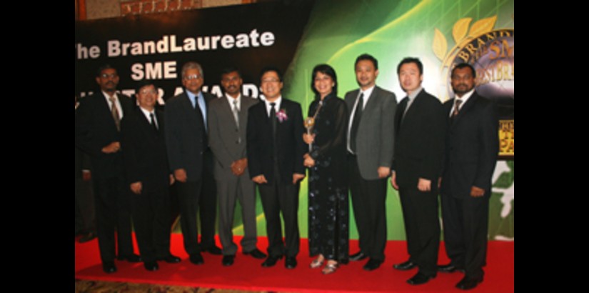 UCSI University staff posing with the trophy after the win