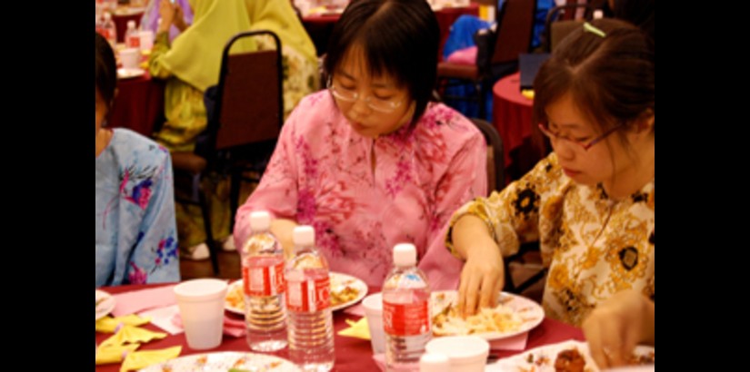 Some UCSI students eating with their hands for the first time