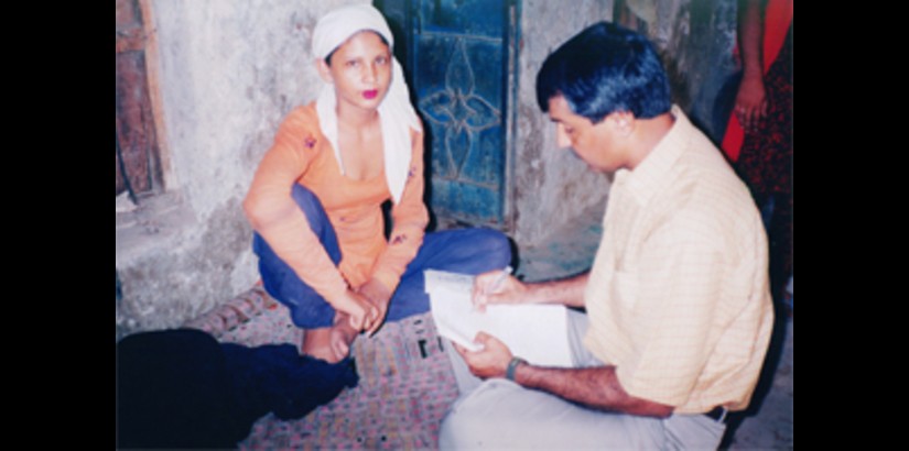 Dr. Gul during his fieldwork in Pakistan, interviewing one of the sex workers