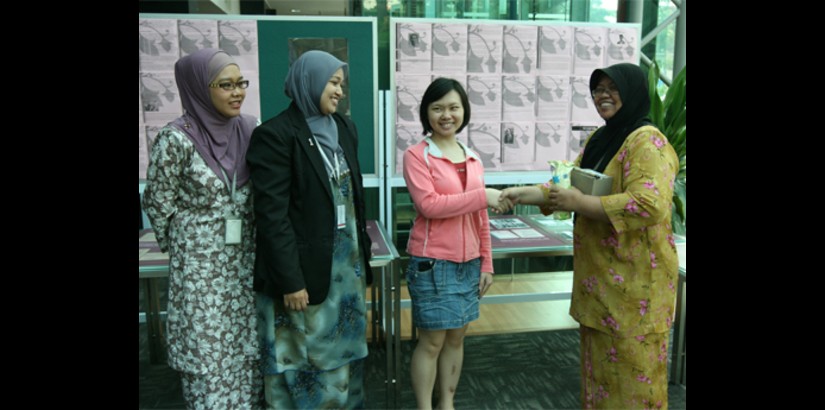 Head of UCSI University’s Library Services, Puan Zuraini Sayuti (far right) hands over one of the grand prizes to one of the winners, Jenny Wong