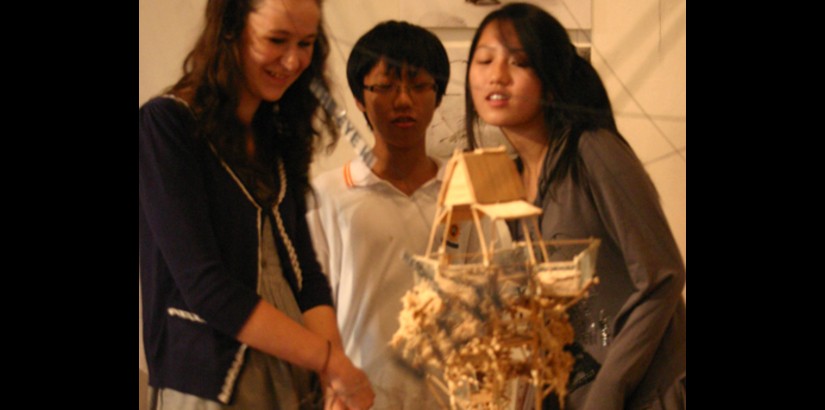 Members of the public taking a look at one of the art pieces at the exhibition