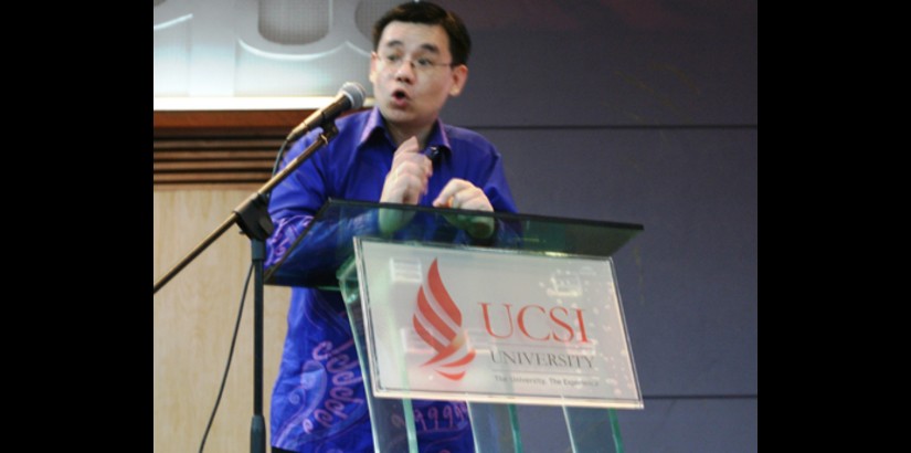 Dr. Phang emphasises a point during his presentation