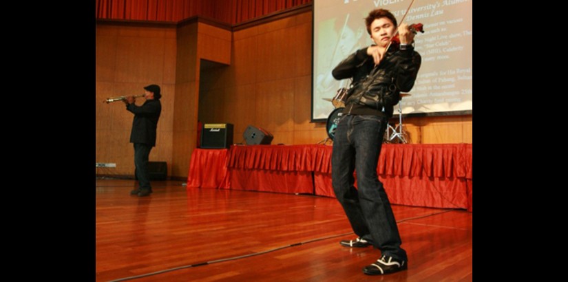 Dennis Lau (right) and Jimmy Sax entertain the crowd