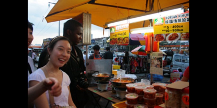 UCSI University student, Henry Angala, accompanying one of the SMU students during a trip to the night market in Cheras UCSI University student, Henry Angala, accompanying one of the SMU students during a trip to the night market in Cheras
