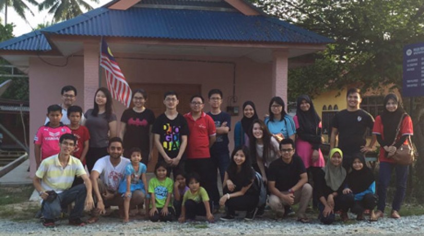 The team pictured with some of the villagers from Kampung Jerong Seberang.