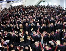 A clearly overjoyed Class of 2017 proudly showing their hard-earned scroll