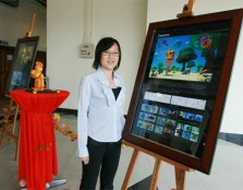 Final year student, Chan Kar Munn next to her artwork