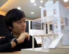 Student constructing architectural model