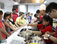  READY TO BAKE: Chef Loke Hoi Weng in the midst of briefing participants on pastry-making during the "Culinary Workshop for Charity".