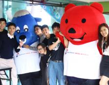 Chai (second from left) and his fellow student organisers with the Bursa Malaysia mascots at the event.