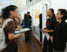 A student enquires about a job at one of the booths